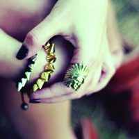 women wearing gold and silver spiked bracelets