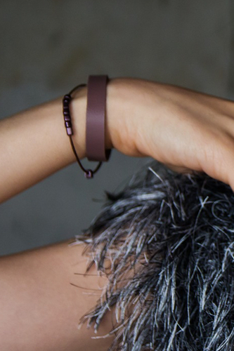 women wearing brown leather bracelets